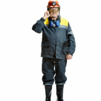Studio shot of serious senior bearded male miner in professional helmet with smartphone standing at the camera isolated on a white studio background. Worker and industry concept. Mature caucasian model